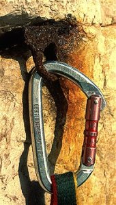 Old piton with carabiner clipped to it